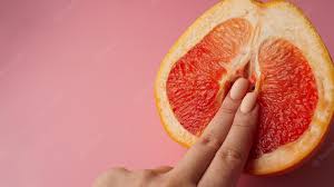 A picture of someone touching fresh fruit.