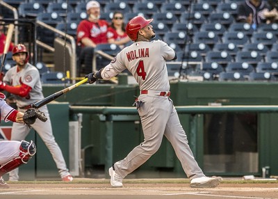 Yadier Molina swinging a bat