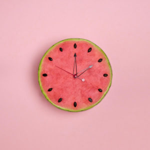 A clock made of a watermelon.